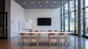 XYZ-Technologies_Sanaaq-modern-bright-event-hall-with-tables-and-TV-screen